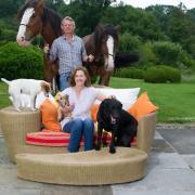 Martin Clunes with his wife Philippa and two of their horses