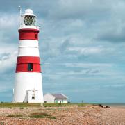 Orfordness Lighthouse stood on Orfordness for more than two centuries. Now it has been demolished as the tide eroded the shingle spit beneath it. Image: Getty Images