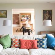 Melissa stuck with a neutral palette for the walls and large pieces of furniture such as sofas, and put in pops of colours using cushions  in the lounge