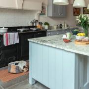 The kitchen units and island were handmade by Midelwood and painted in Mylands paint Mid Wedgwood and Hawkesmoor. The Bianco Lation granite worktops came from Bristol Marble and Granite Ltd while the pendant lights came from La Fleure in Langport