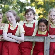 Some of the Knighton House pupils in their practical and distinctive red dungarees