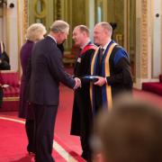 The award was presented at Buckingham Palace