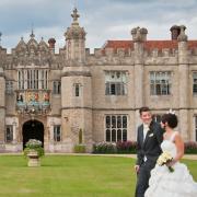 Amie and James Roller outside the stunning Hengrave Hall, on their wedding day. Picture by Sonya Duncan Photography