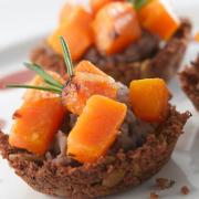 Chestnut and pumpkin seed croustade cups with butternut squash and cranberry jus