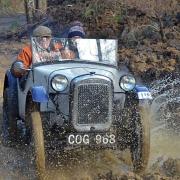 Grant Sellers and Henry Pearson, of Ashover, take the ‘Chez Perez’ watersplash in their 1936 Austin 7