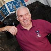Award-winning teacher Barry Brindley loads a container for Malawi