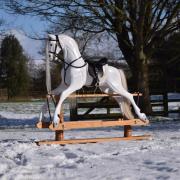 A beautiful winter white rocking horse 