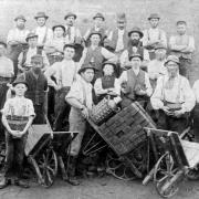 Suffolk brickworkers pose for a photograph displaying some of their products.