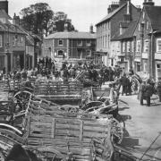 Market day in Sturminster Newton in 1906. The fortnightly Monday market moved from the town square later that year to a site near the station