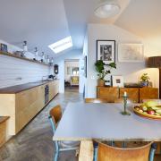 The kitchen with parquet floor and Natural History Museum worktops, dating back to 1910