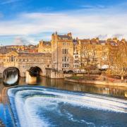 A sunny day in Bath at Pulteney Bridge above the River Avon. Photo: Getty/benedek