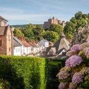 The amazing Dunster castle stands tall over the village. Photo: Getty/Wirestock