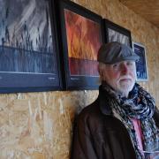 Terry Bryan inside one of the Minsmere hides where his work is on display.