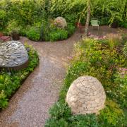 Horatio's Garden at Chelsea Flower Show 2023. The water feature incorporates Sheffield steel cutlery and the stone cairns are inspired by the Peak District