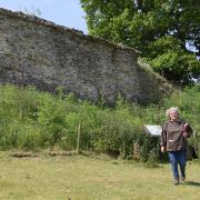 Caistor Roman Project trustee, Alex Atherton, by part of the remaining walls on the north side of the Roman Town. Picture: Denise Bradley