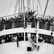 The HMT Empire Windrush with people from the Caribbean who answered Britain's call to help fill post-war labour shortages on arrival at the Port of Tilbury