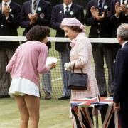 Queen Elizabeth II talking to Britain's Virginia Wade after presenting her with the trophy as Women's Singles Champion 1977