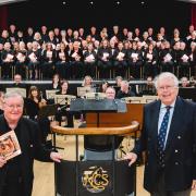 The choral society with John Naylor, music director (left) and John Lea, President of NCS. Photo: Malcolm Hart