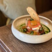 Isle of Wight mi-cuit tomatoes, burrata, brown butter sourdough, basil, consomme (c) Three Horseshoes