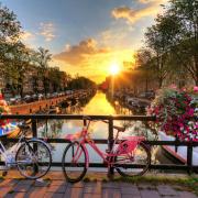 Sunrise on the famous UNESCO world heritage canals of Amsterdam