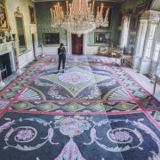Curator Zoe Shearman in the Saltram Saloon following the installation of the protective reweave created by Axminster Carpets. Photo: National Trust/Steve Haywood