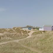 Old Hunstanton Beach is backed by sand dunes and beach huts