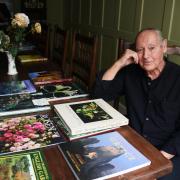 Former Fleet Street photographer Clay Perry, at Harleston with some of his books at his heritage fruit and vegetable exhibition. Photo: Denise Bradley
