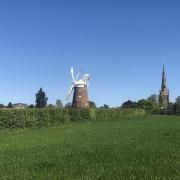 Thaxted Windmill with the church in the background Credit: The Trustees of Thaxted Windmill
