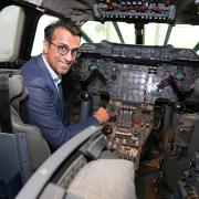 Dr Vikas Shah at the controls of Concorde at Manchester Airport's Runway Visitor Park. Photo: Kirsty Thompson