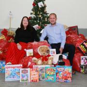 Dee and Chris Drake with a selection of toys for the appeal. PHOTO:Kirsty Thompson