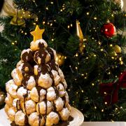 A snowy profiterole tower makes a Christmas centrepiece with the wow factor. Photo: Steve Adams