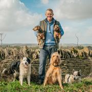Adam Henson at home on the farm with his hounds. Photo: cotswoldfarmpark.co.uk