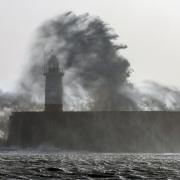 Storm Gerrit battering the harbour arm and lighthouse at Newhaven in East Sussex this morning at high tide