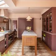 Shades of plum provide a pop of colour whilst keeping the space warm and soothing CREDIT Herringbone Kitchens