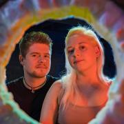 Charlie and Amelia Burke seen through the mouth of the glass furnace. (Photo: Stephen Sheridan, Sheridan's Photography)