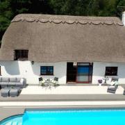 Features of the cottage include a swimming pool, jacuzzi and its own private pub