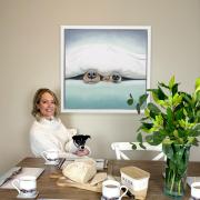 Lucy with Duvet Day canvas and merch