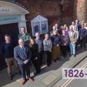 The Chichester team outside the firm’s head office in Baffins Lane