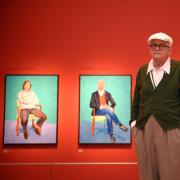 David Hockney with some of his portraits at the Royal Academy of Arts