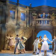 Helen George as Tracy Lord and the cast of High Society