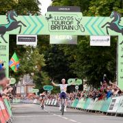 Lewis Askey celebrates winning stage one of the 2026 Lloyds Tour of Britain in Lincoln