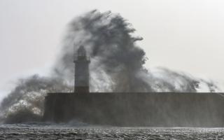 Storm Gerrit battering the harbour arm and lighthouse at Newhaven in East Sussex this morning at high tide