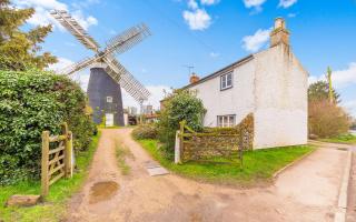 Bardwell Windmill is for sale with a cottage, flint barn and workshop.