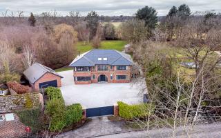 A contemporary double fronted property set in over two acres of grounds