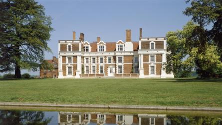 The south facade of the house with the pond in the foreground Credit: Historic England