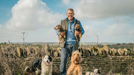 Adam Henson at home on the farm with his hounds. Photo: cotswoldfarmpark.co.uk