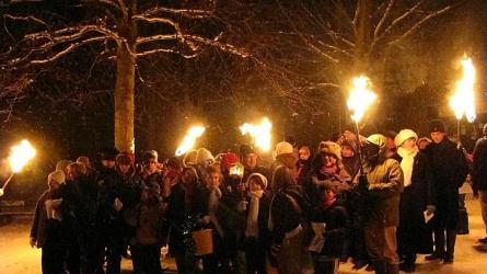 The torchlit Wassail procession makes its way to the New Ash Green Community orchard [Photo courtesy of New Ash Green Woodlands Group]