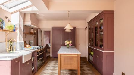 Shades of plum provide a pop of colour whilst keeping the space warm and soothing CREDIT Herringbone Kitchens